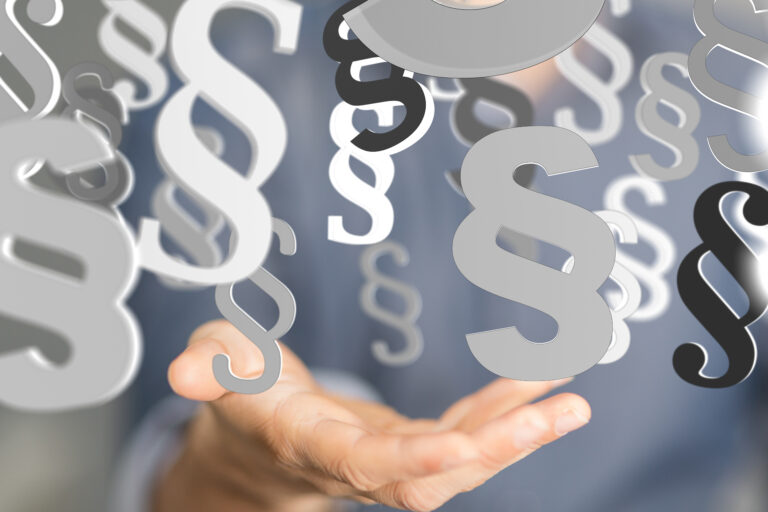 Hand und Paragraphen-Zeichen