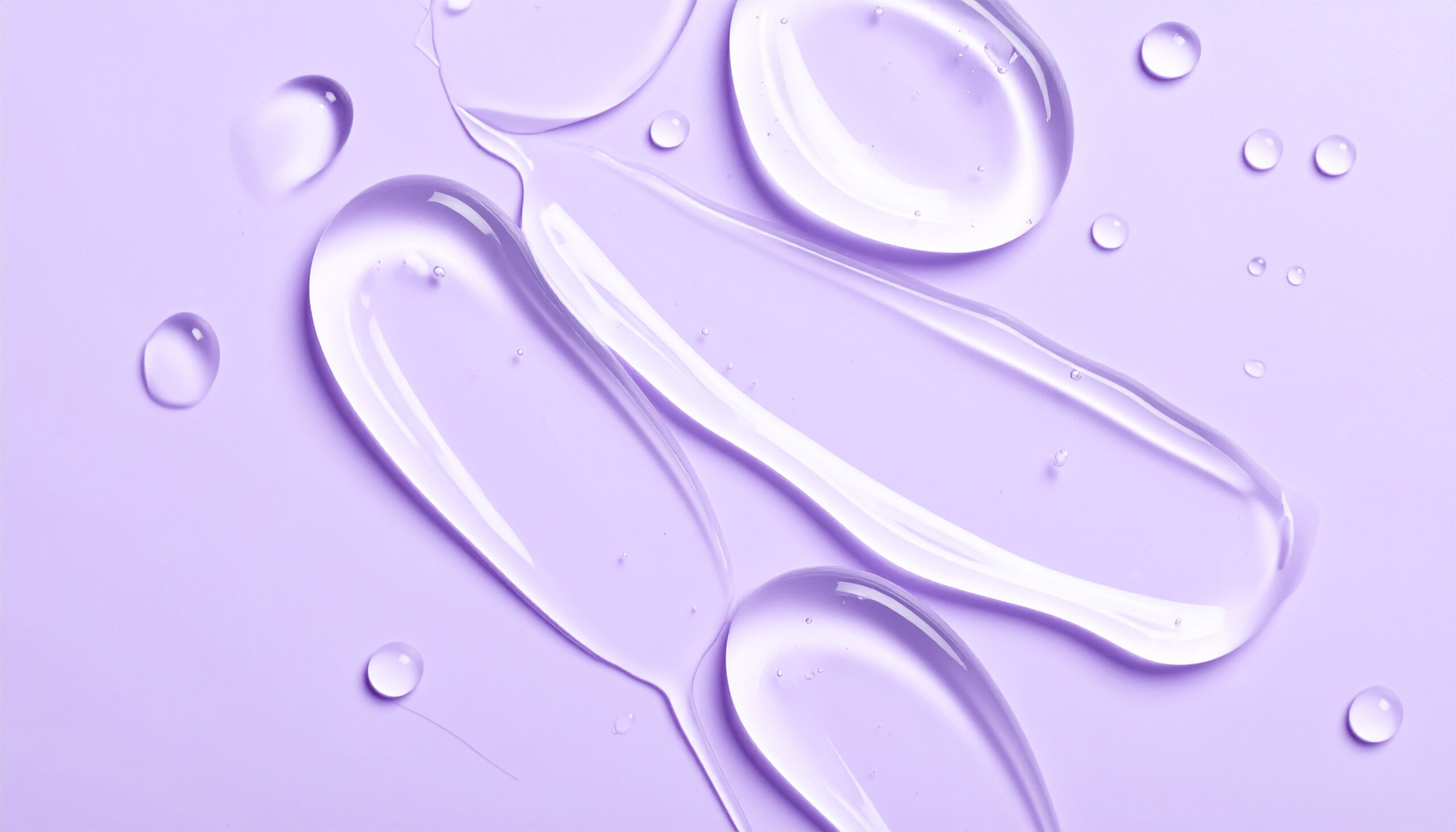 Flüssigkeit auf lila Untergrund